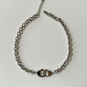 Mens, handcuff chain bracelet is stainless steel with a highly polished finish.